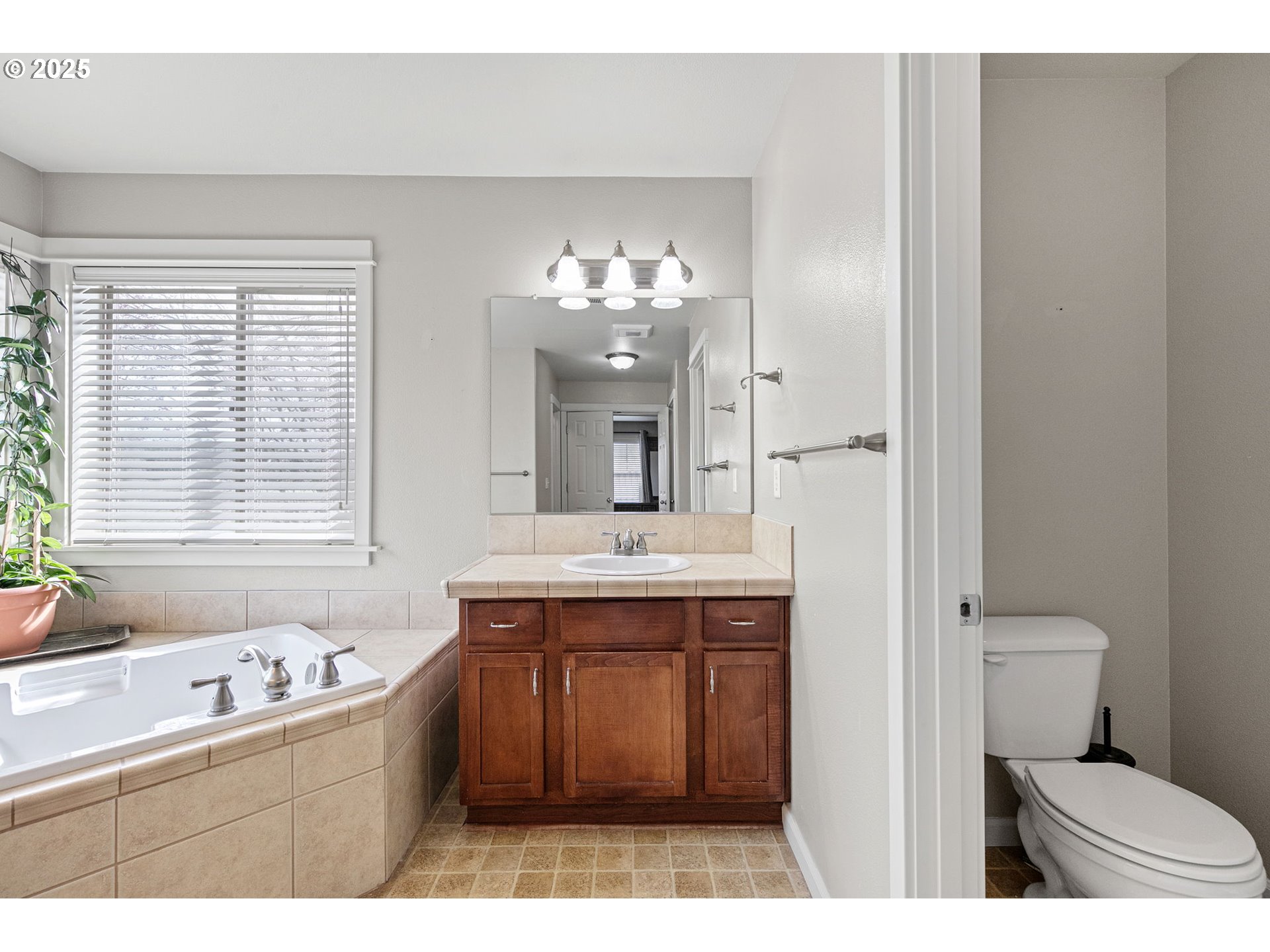 5462 Pranz Place Eugene, OR 97402 - Photo 27 of 43 a bathroom with a sink and a mirror