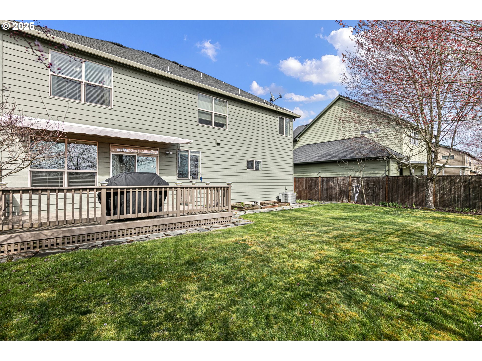 5462 Pranz Place Eugene, OR 97402 - Photo 38 of 43 a backyard of a house with a garden and deck