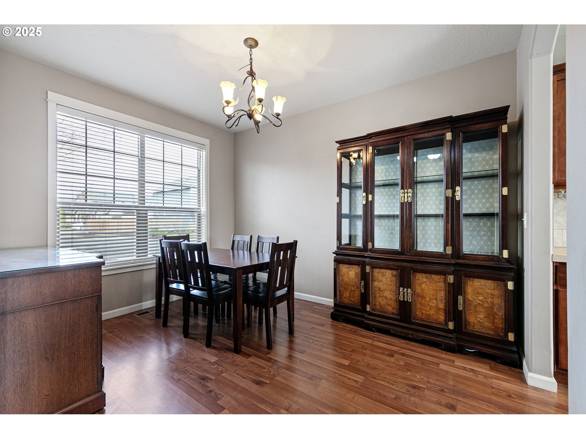 5462 Pranz Place Eugene, OR 97402 - Photo 6 of 43 a view of a dining room with furniture window and wooden floor