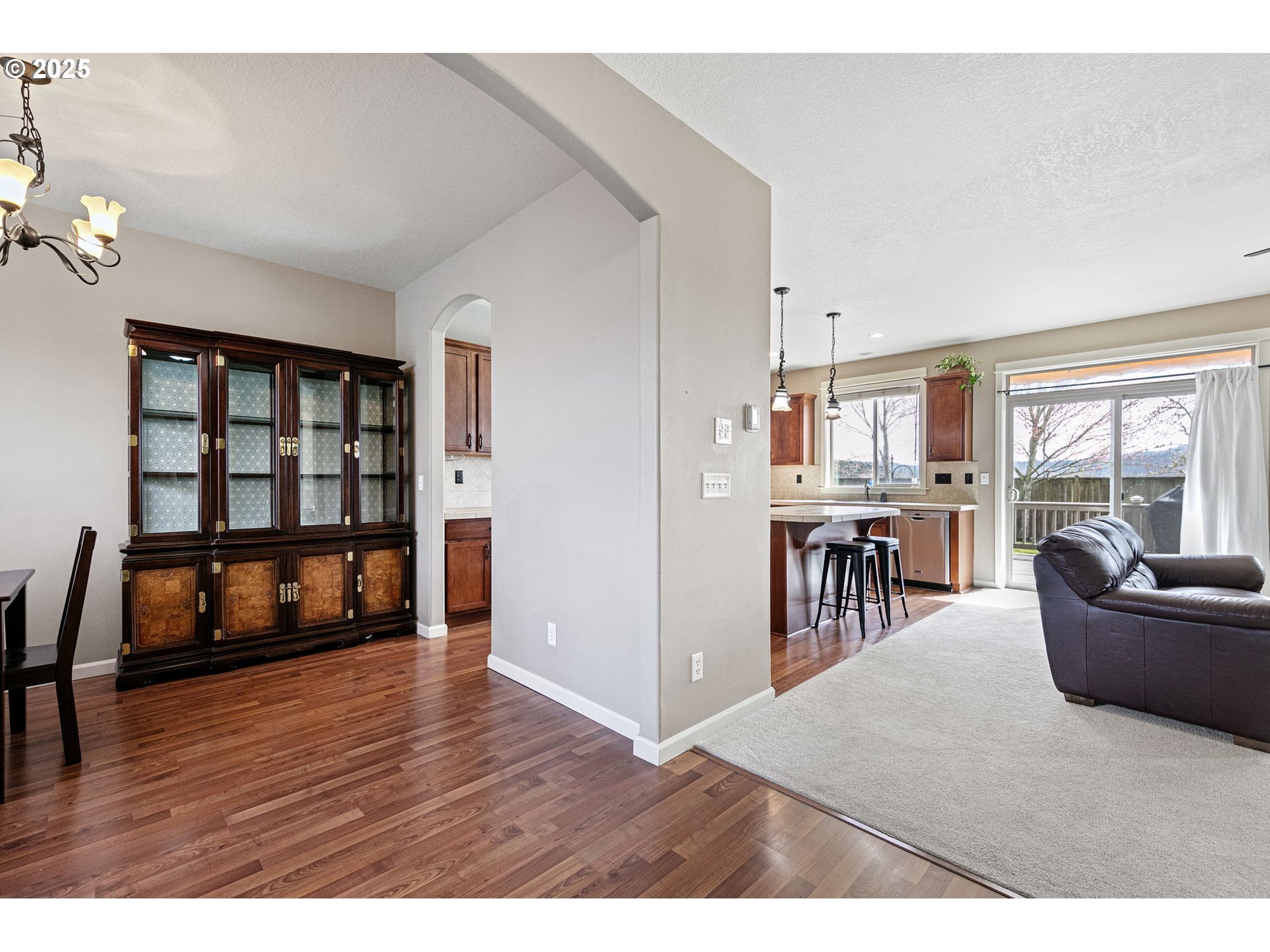 5462 Pranz Place Eugene, OR 97402 - Photo 9 of 43 a living room with furniture and a wooden floor