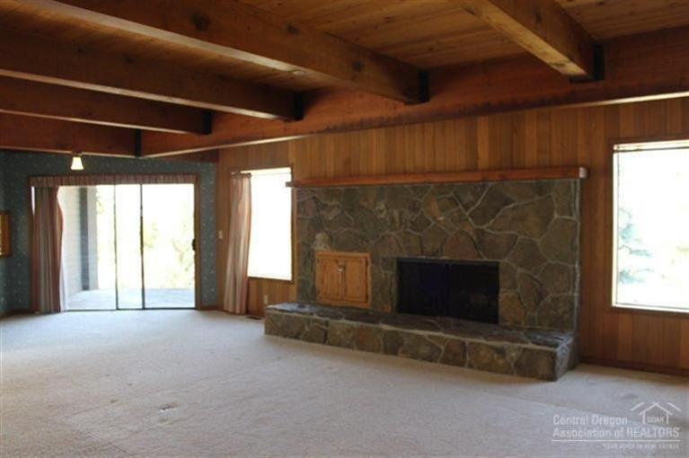 66275 Gerking Market Road Bend, OR 97703 - Photo 9 of 25 Living room with rock fireplace, made fr