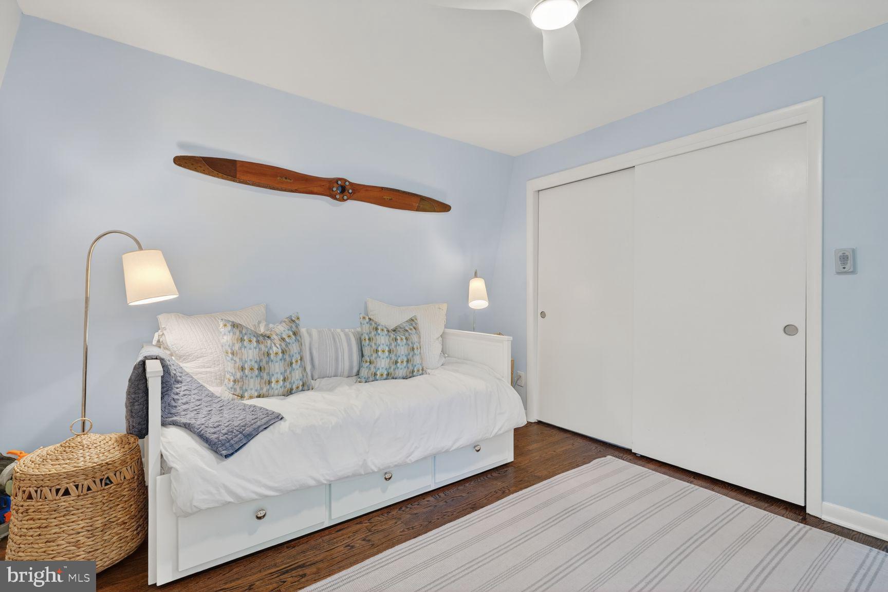 11201 Wedge Drive Reston, VA 20190 - Photo 24 of 31 a bedroom with a bed and a lamp