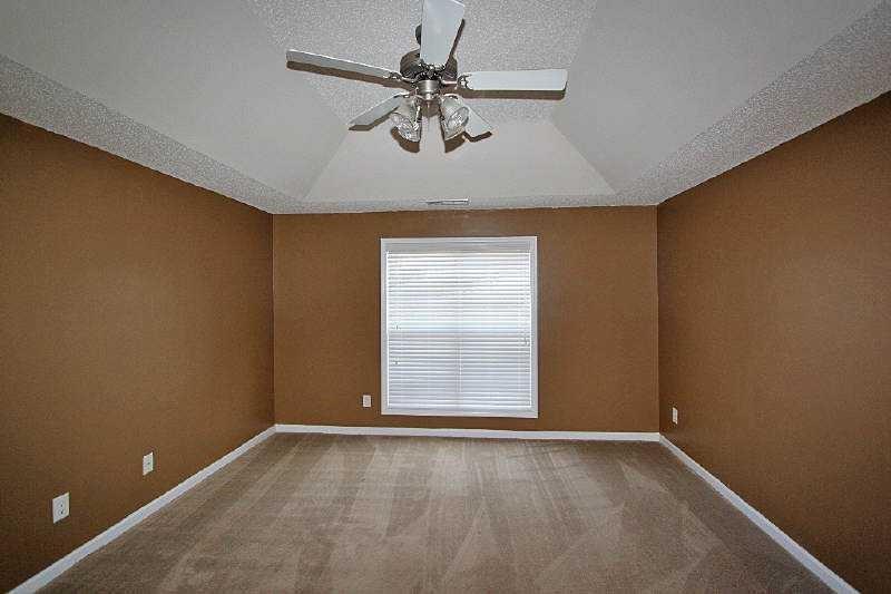 210 Joe Graham Road Hull, GA 30646 - Photo 16 of 21 an empty room with a window and a ceiling fan