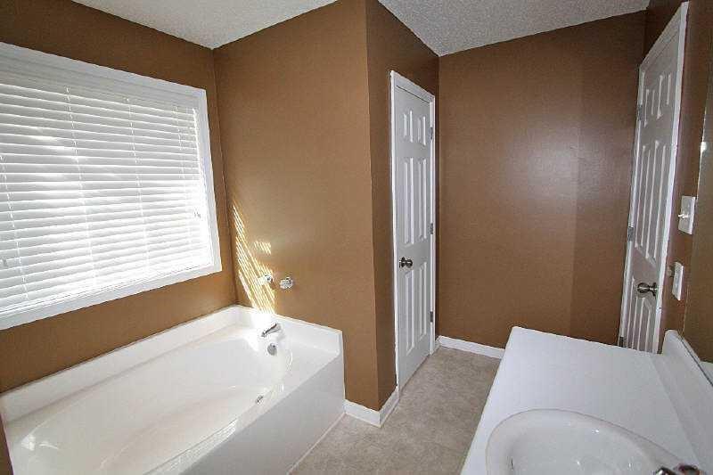 210 Joe Graham Road Hull, GA 30646 - Photo 19 of 21 a bathroom with a bathtub and a shower