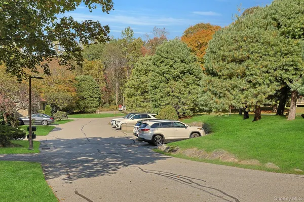a front view of a house with swimming pool having outdoor seating