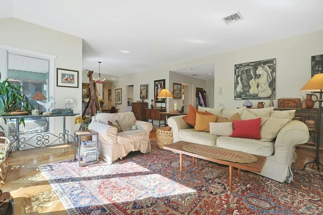 a living room with furniture and a rug