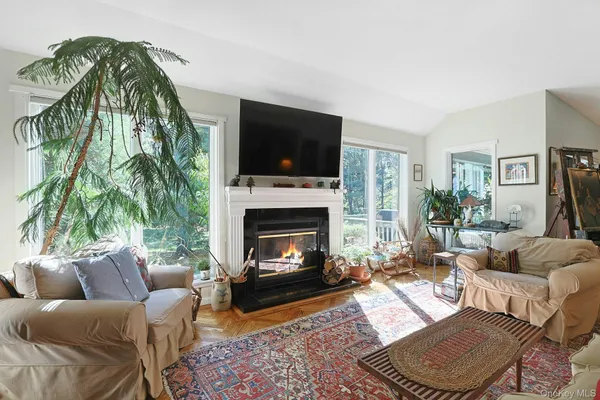 a kitchen with stainless steel appliances granite countertop a kitchen island a stove a table and chairs