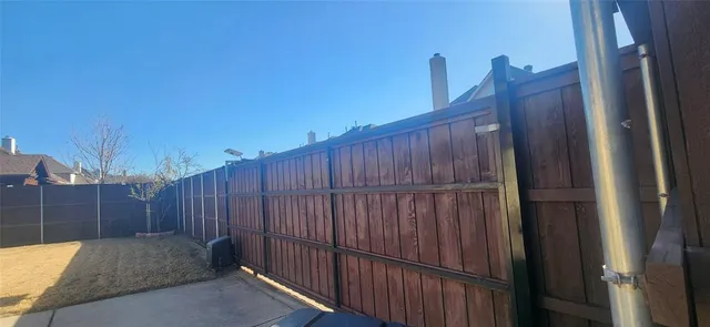 a view of backyard with large windows