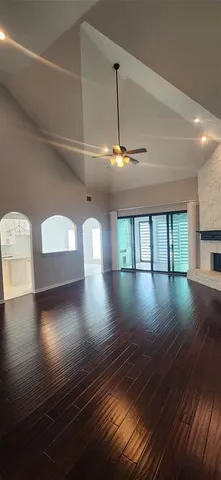 a view of room with window and wooden floor