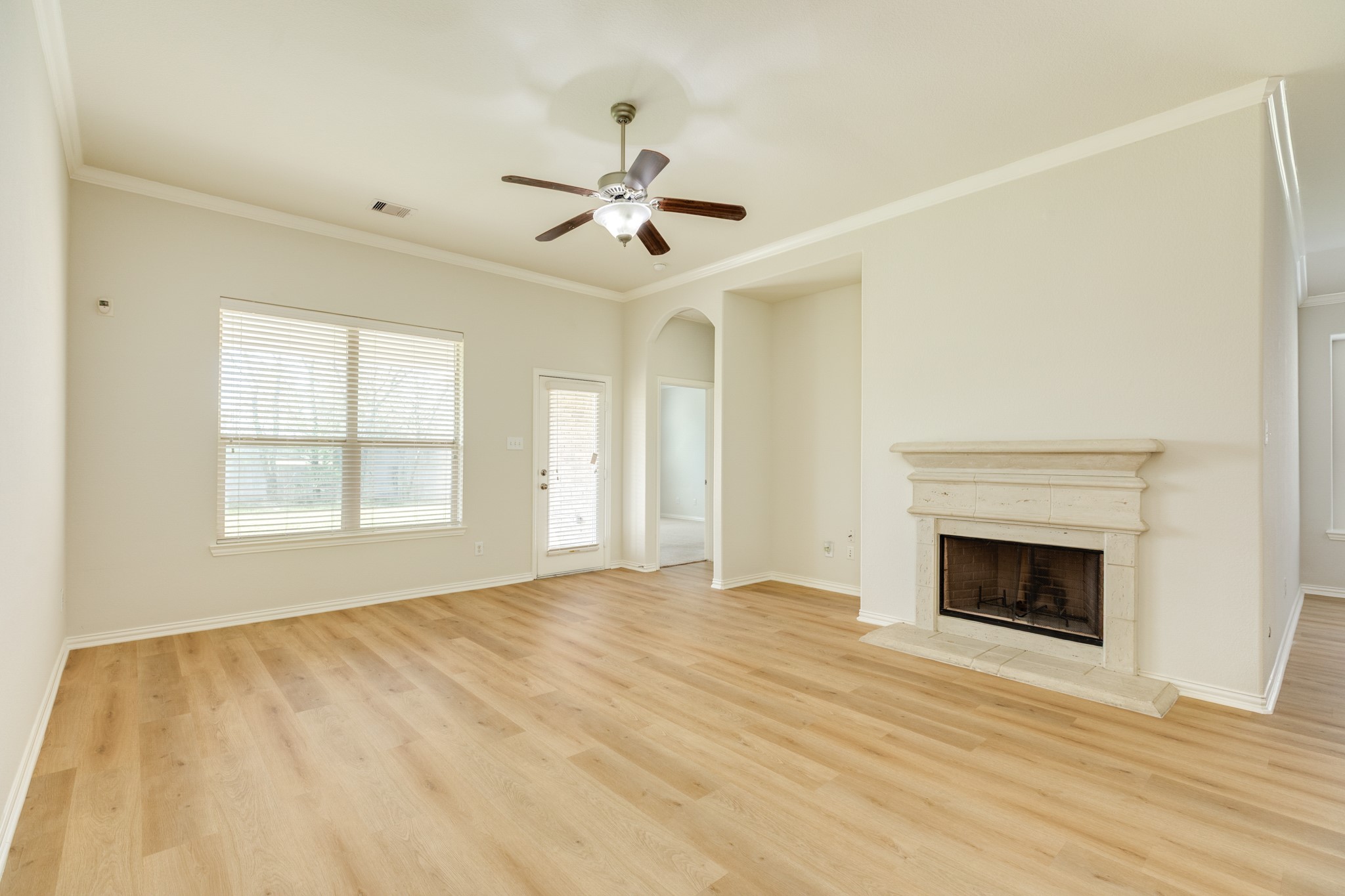 13417 Star Creek Lane Rosharon, TX 77583 - Photo 14 of 41 Family Room: Spacious with a gas fireplace surrounded by beautiful stone, and a back door leading to an oversized backyard.