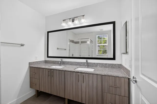 a bathroom that has a toilet and a shower