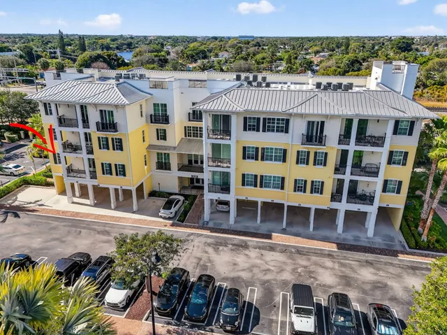 an aerial view of a house with a yard and potted plants