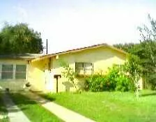 a view of a swimming pool with a yard