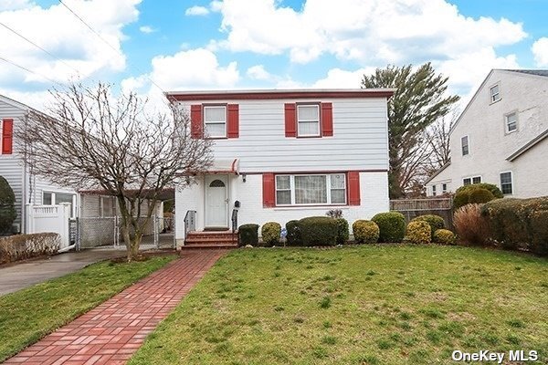 75 Rutland Road Hempstead, NY 11550 - Photo 1 of 1 a front view of a house with a yard