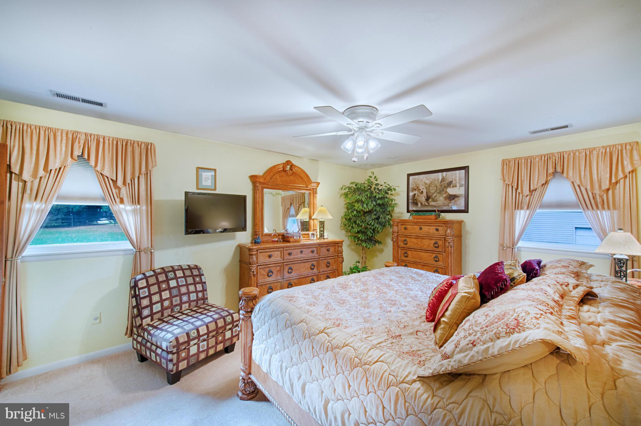 536 Stratford Road Fallston, MD 21047 - Photo 14 of 30 a bedroom with a bed and a flat screen television