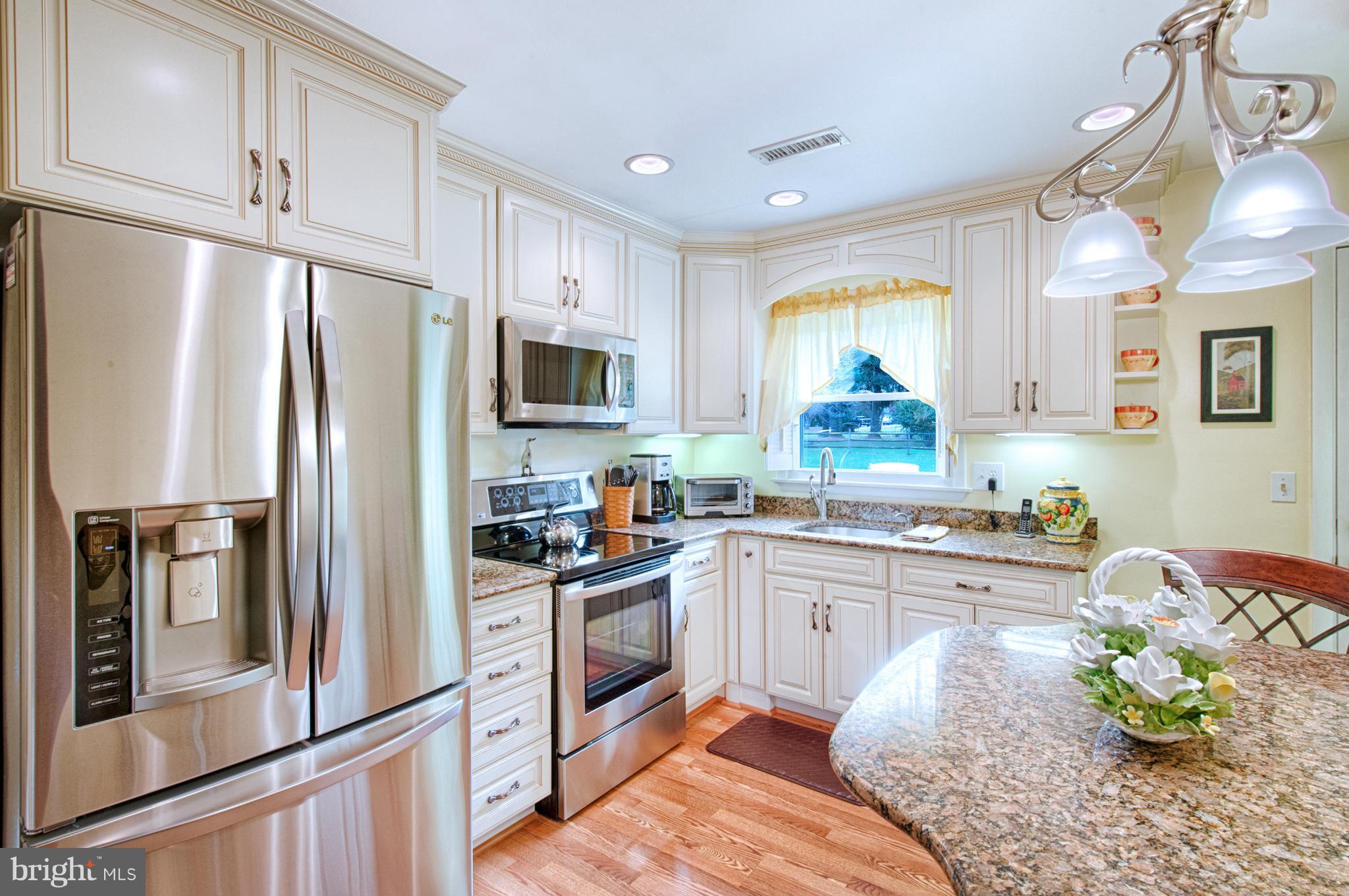 536 Stratford Road Fallston, MD 21047 - Photo 8 of 30 a kitchen with stainless steel appliances granite countertop a refrigerator sink and stove
