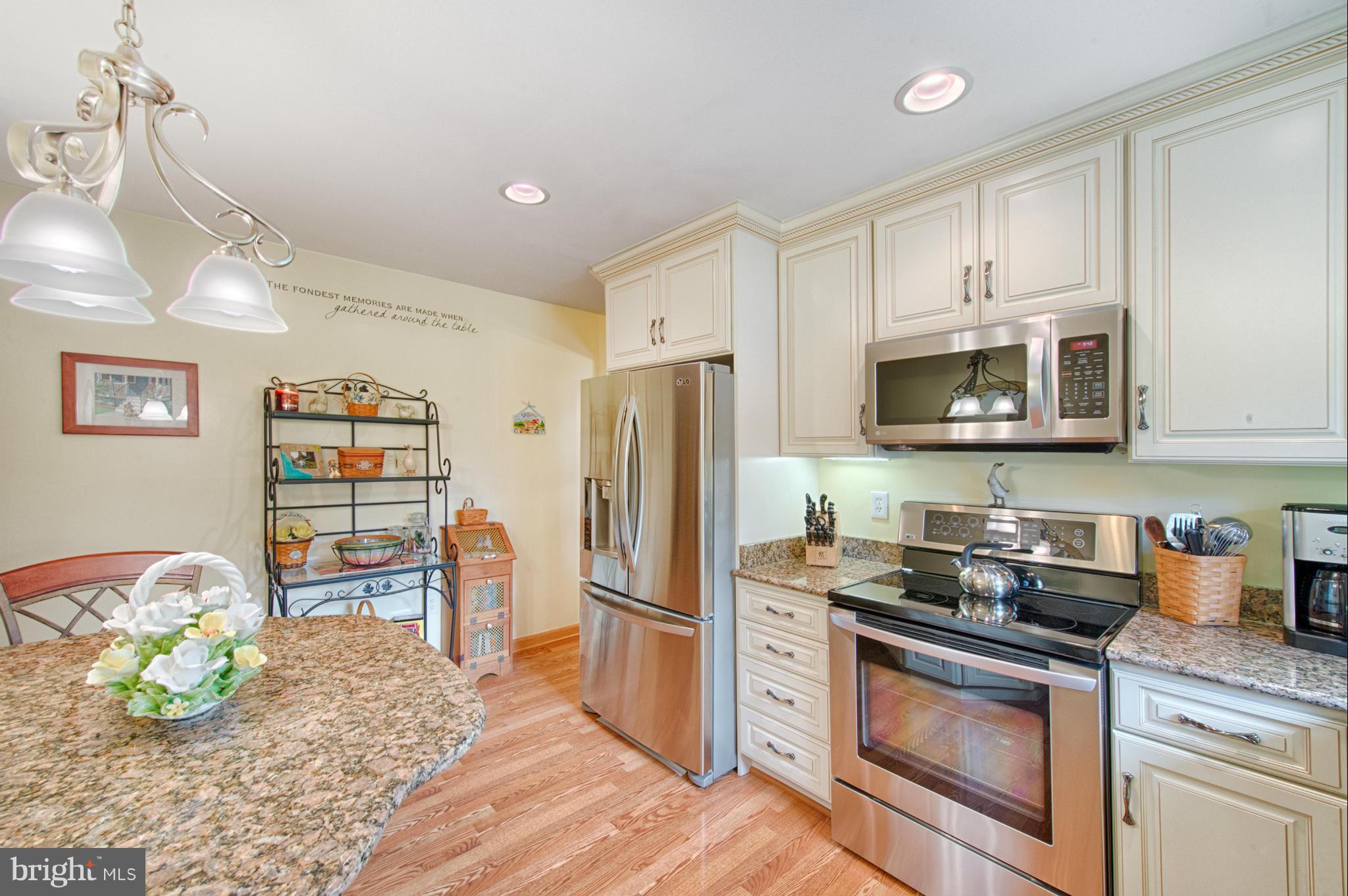 536 Stratford Road Fallston, MD 21047 - Photo 9 of 30 a kitchen with granite countertop a stove a sink and a refrigerator