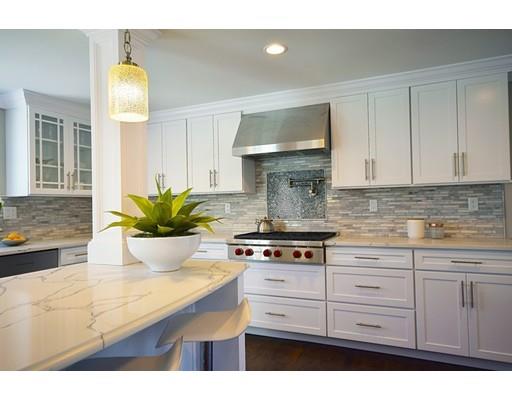 64 Bristol Road Wellesley, MA 02481 - Photo 5 of 28 a kitchen with stainless steel appliances a white stove top oven and cabinets