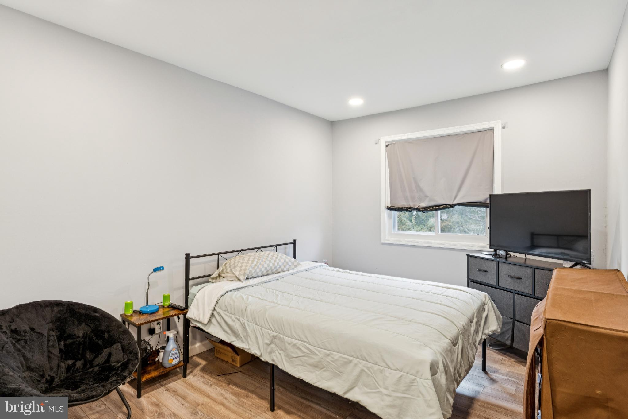 22 Milstone Court Sicklerville, NJ 08081 - Photo 17 of 26 a bedroom with a bed and a flat screen tv