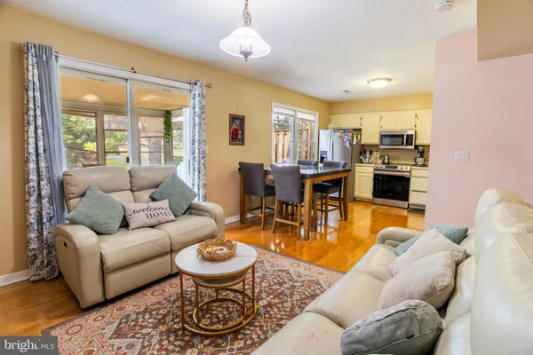 a kitchen with stainless steel appliances granite countertop a refrigerator sink and stove