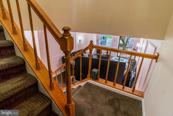 a room with a mirror and a wooden floor