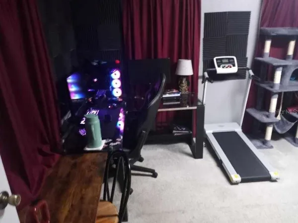 a view of hallway with furniture