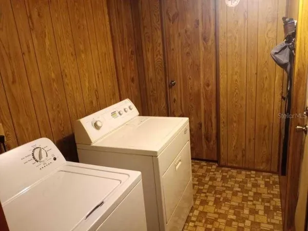 a bathroom with a toilet and a shower curtain