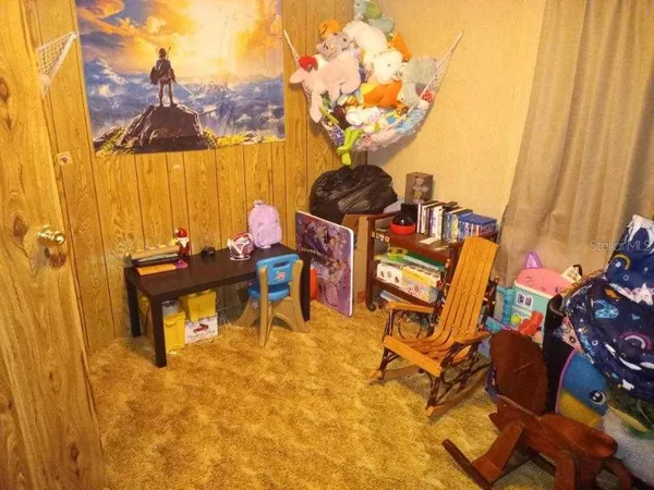 a view of an chairs and tables in the balcony