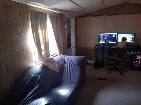 a view of balcony with furniture