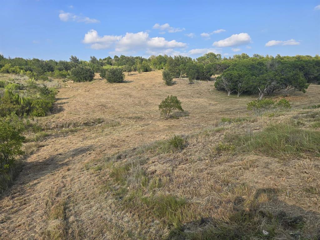 622 Caprock Court Graford, TX 76449 - Photo 4 of 26 a view of a lake with mountains in the background
