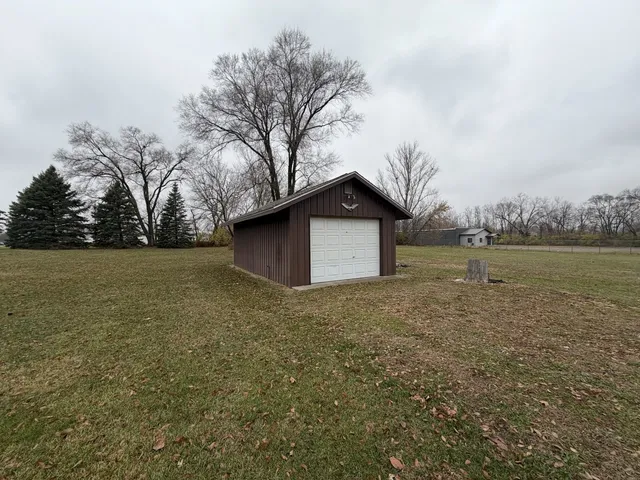 a view of a field with trees