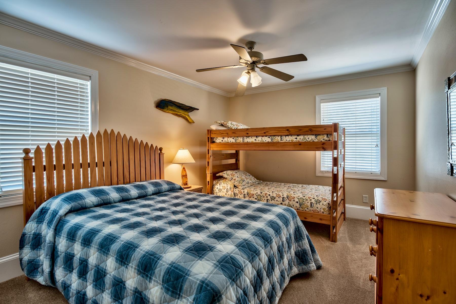 601 Blue Mountain Road Santa Rosa Beach, FL 32459 - Photo 17 of 51 a bedroom with a bed and wooden floor
