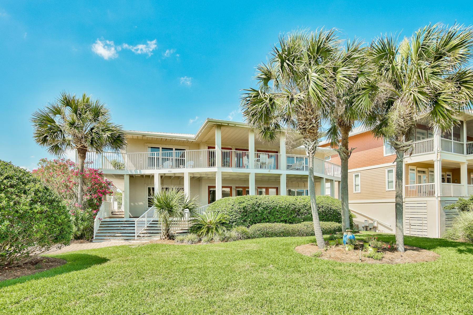 601 Blue Mountain Road Santa Rosa Beach, FL 32459 - Photo 2 of 51 a front view of a house with a yard table and chairs