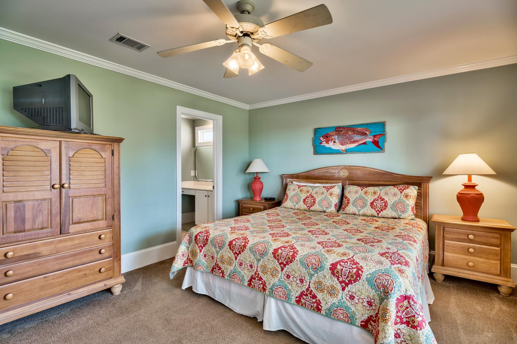 601 Blue Mountain Road Santa Rosa Beach, FL 32459 - Photo 21 of 51 a bedroom with a bed and dresser