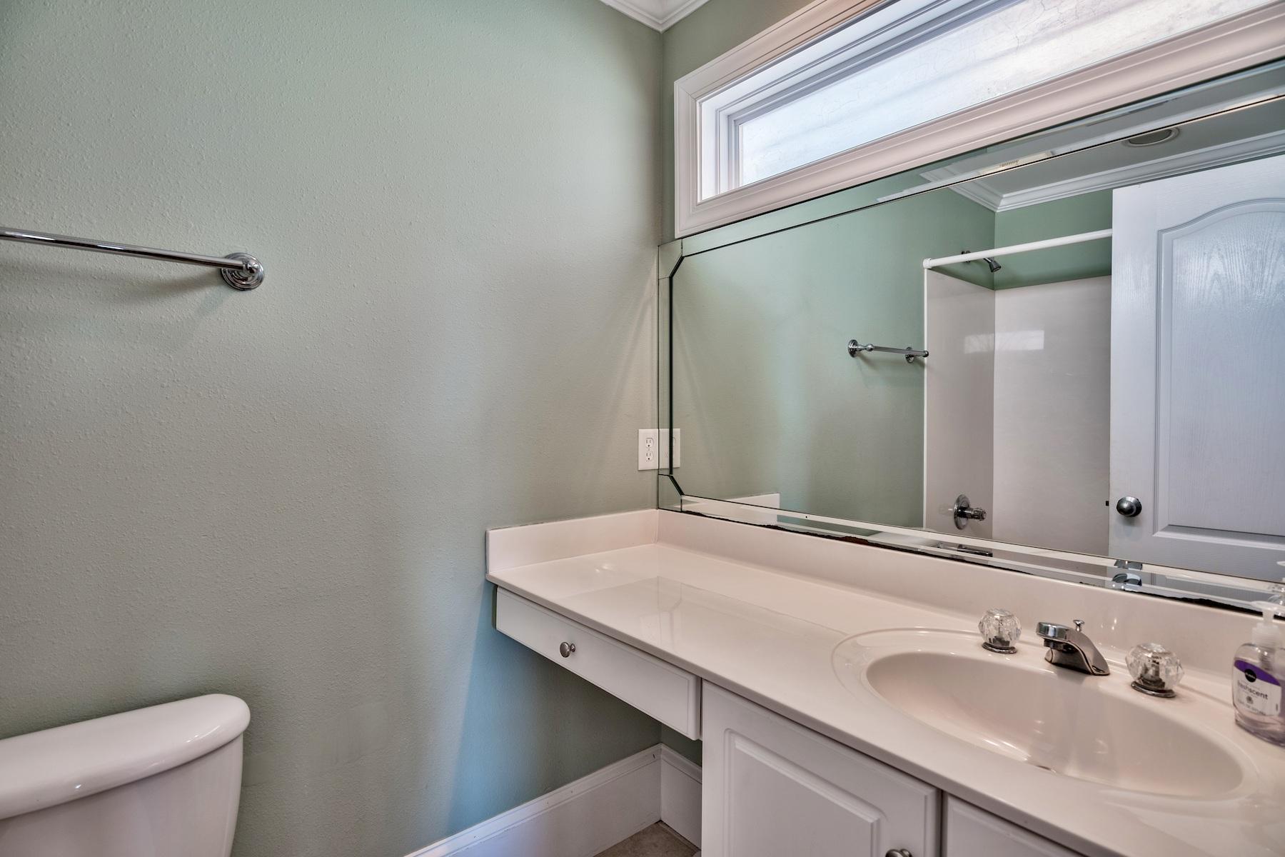 601 Blue Mountain Road Santa Rosa Beach, FL 32459 - Photo 22 of 51 a bathroom with a sink and a toilet