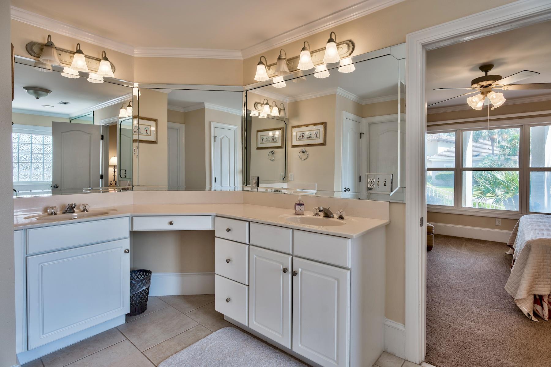 601 Blue Mountain Road Santa Rosa Beach, FL 32459 - Photo 25 of 51 a bathroom with a sink vanity and mirror