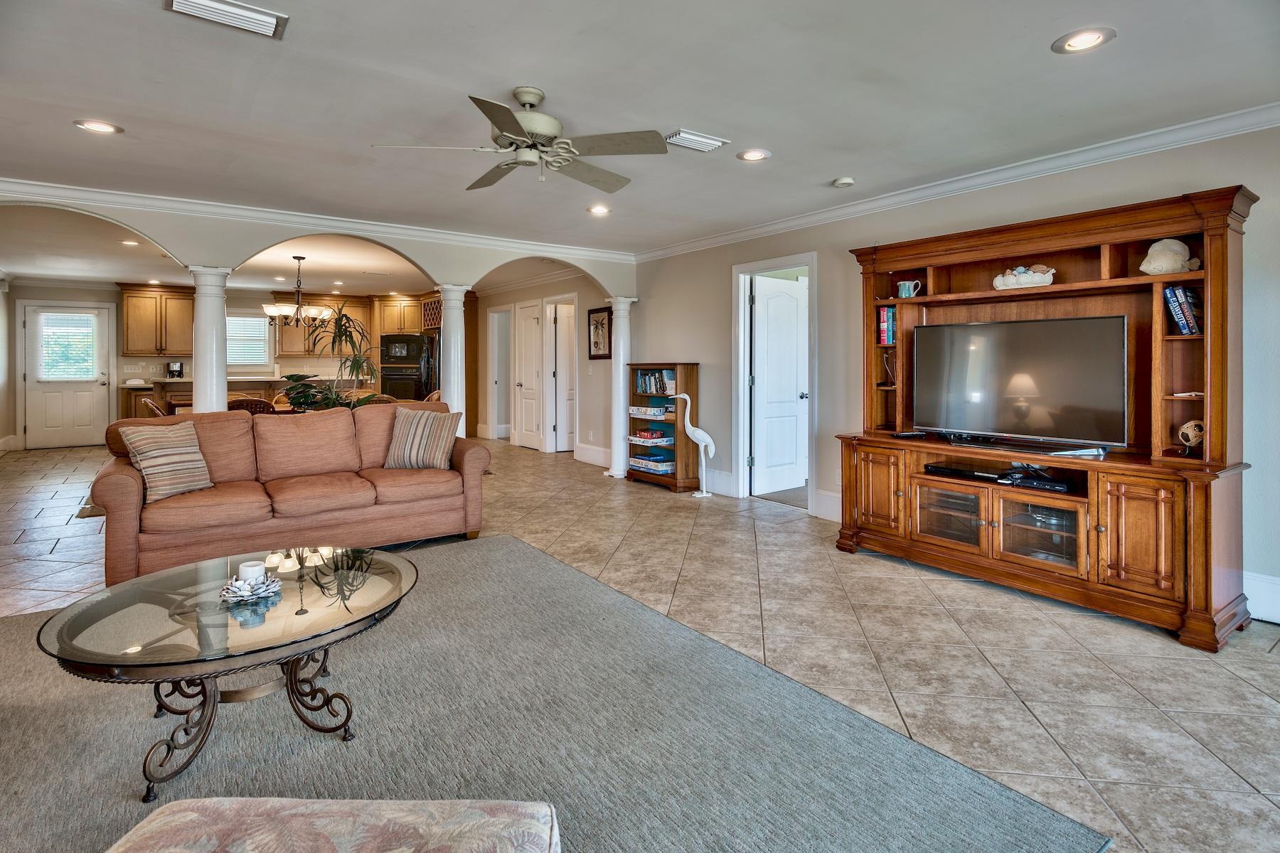 601 Blue Mountain Road Santa Rosa Beach, FL 32459 - Photo 38 of 51 a living room with furniture and a flat screen tv