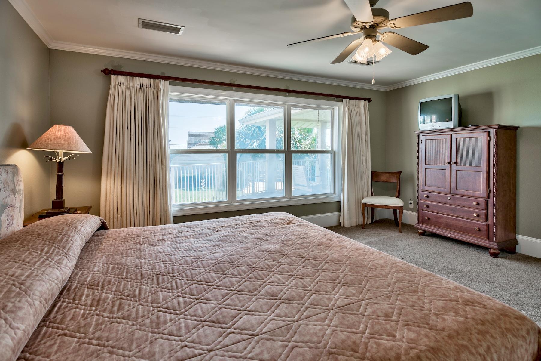 601 Blue Mountain Road Santa Rosa Beach, FL 32459 - Photo 41 of 51 a spacious bedroom with a bed dresser and a window