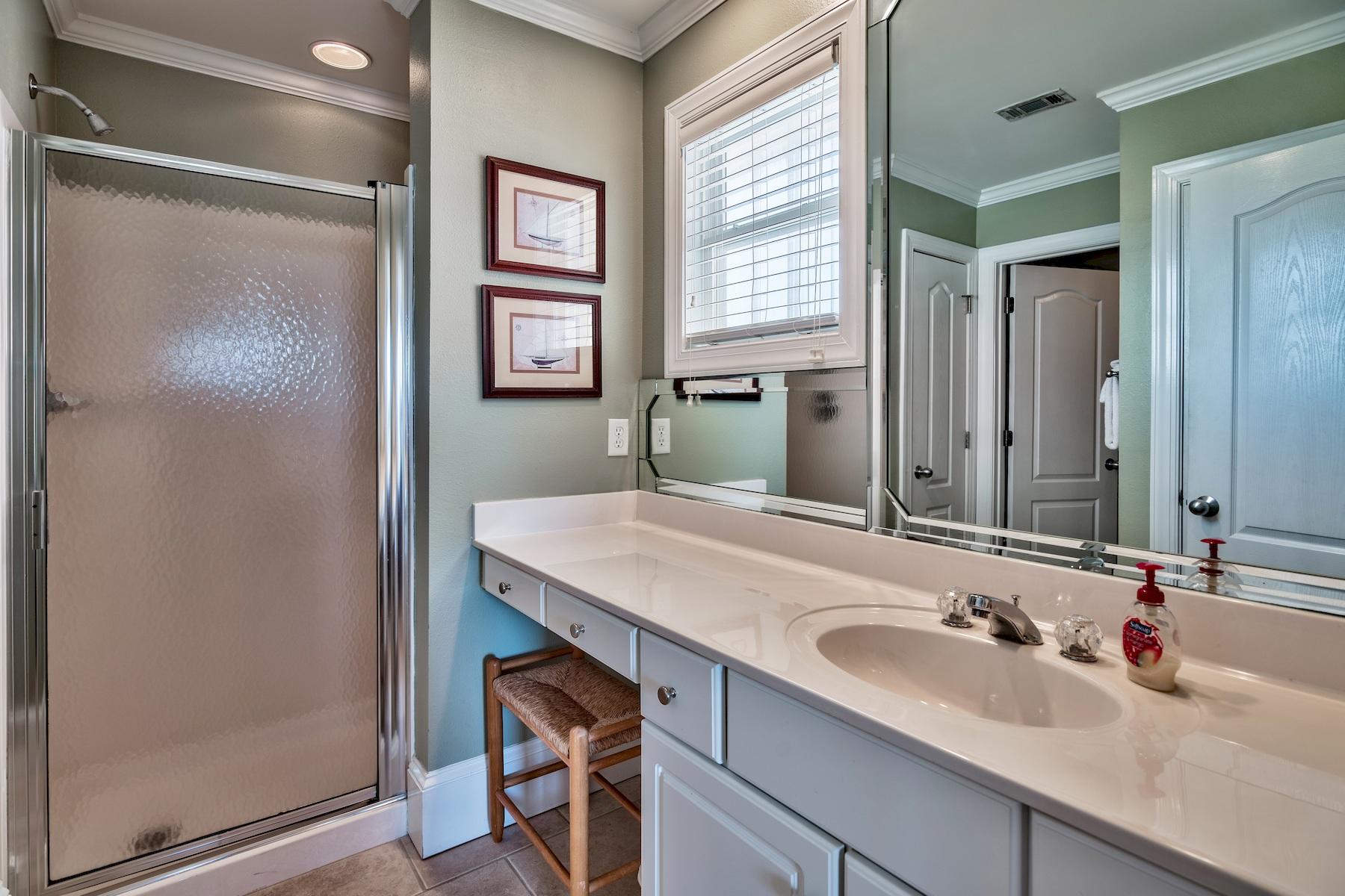 601 Blue Mountain Road Santa Rosa Beach, FL 32459 - Photo 42 of 51 a bathroom with a sink and a mirror
