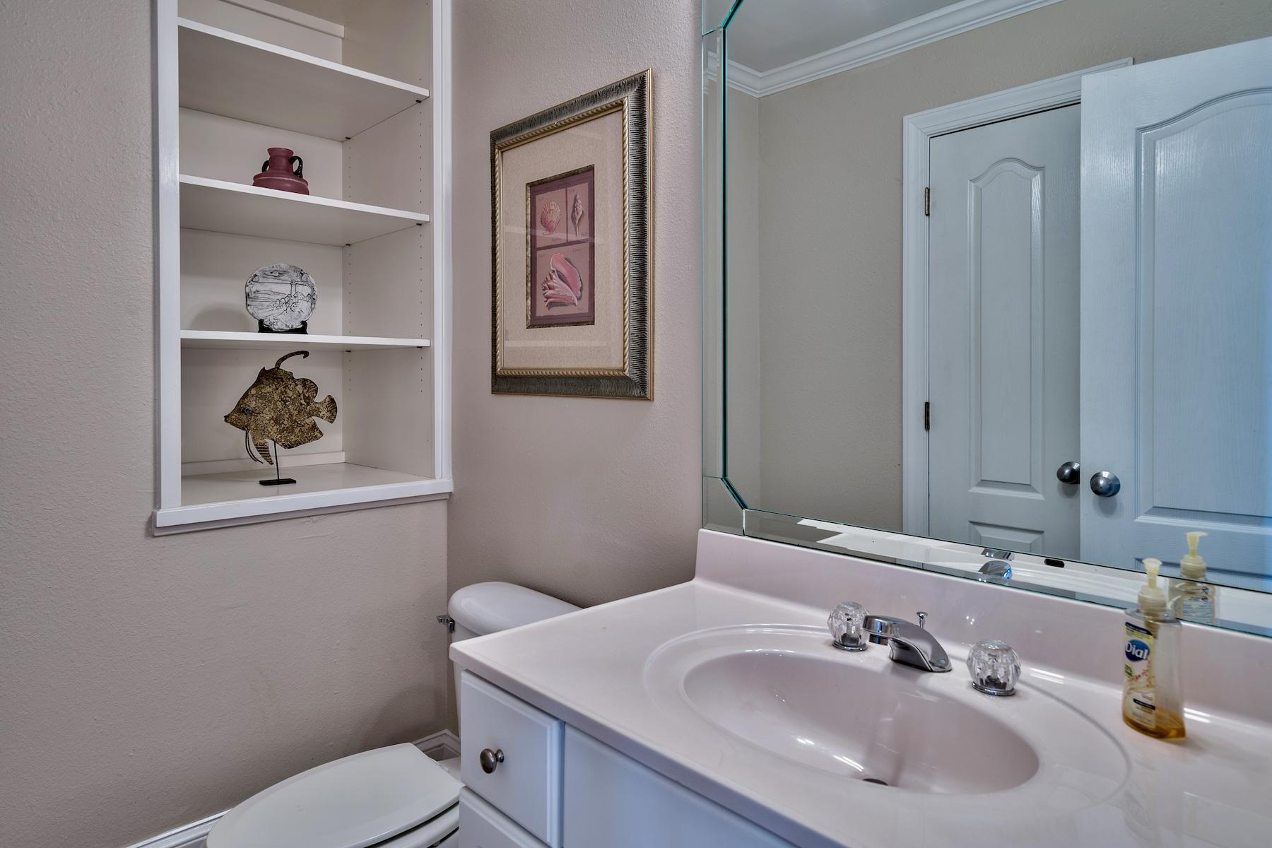 601 Blue Mountain Road Santa Rosa Beach, FL 32459 - Photo 43 of 51 a bathroom with a toilet a sink and mirror