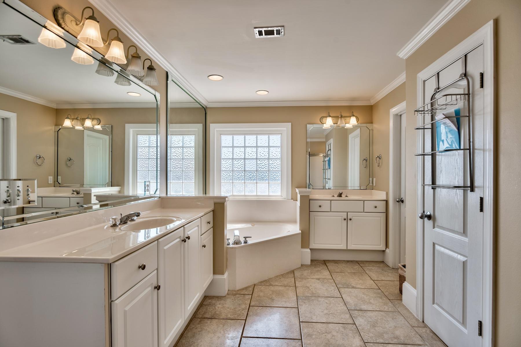 601 Blue Mountain Road Santa Rosa Beach, FL 32459 - Photo 48 of 51 a spacious bathroom with a granite countertop tub sink shower and mirror