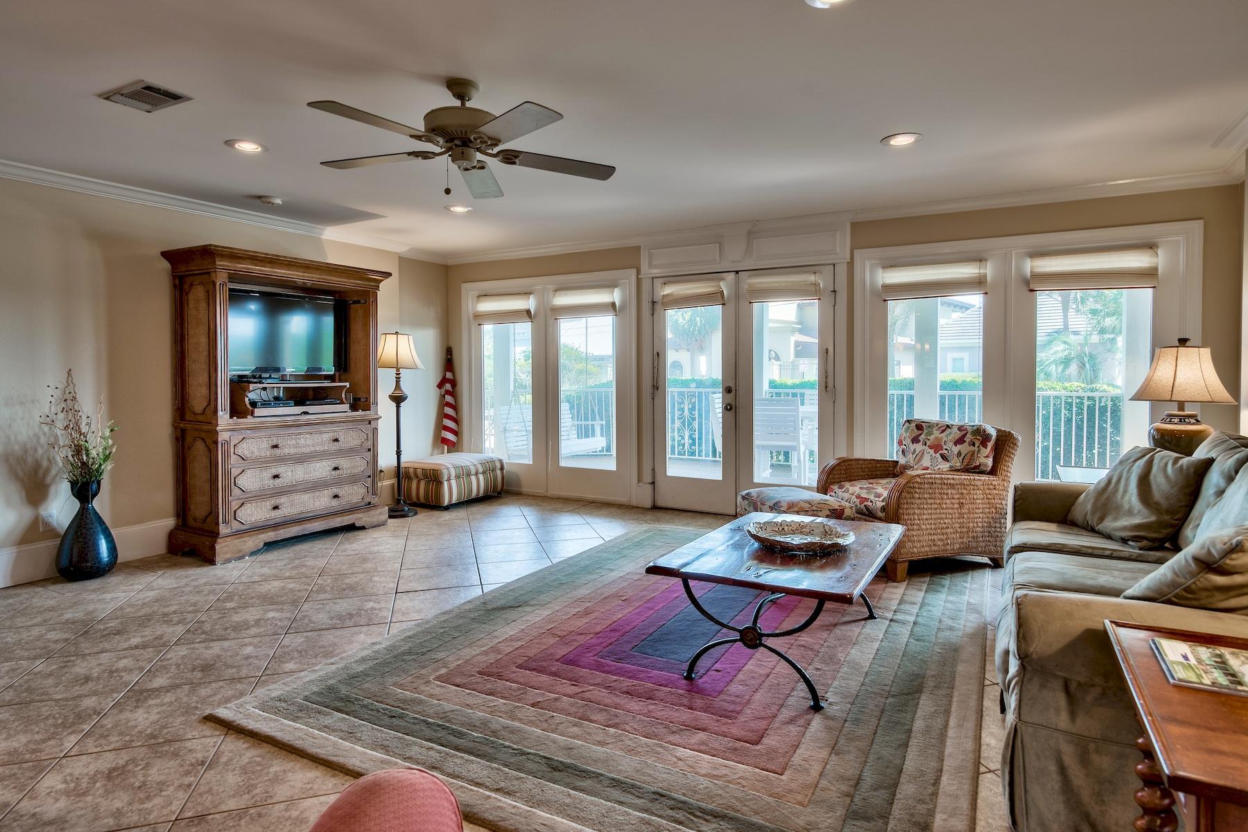 601 Blue Mountain Road Santa Rosa Beach, FL 32459 - Photo 6 of 51 a living room with furniture and a flat screen tv