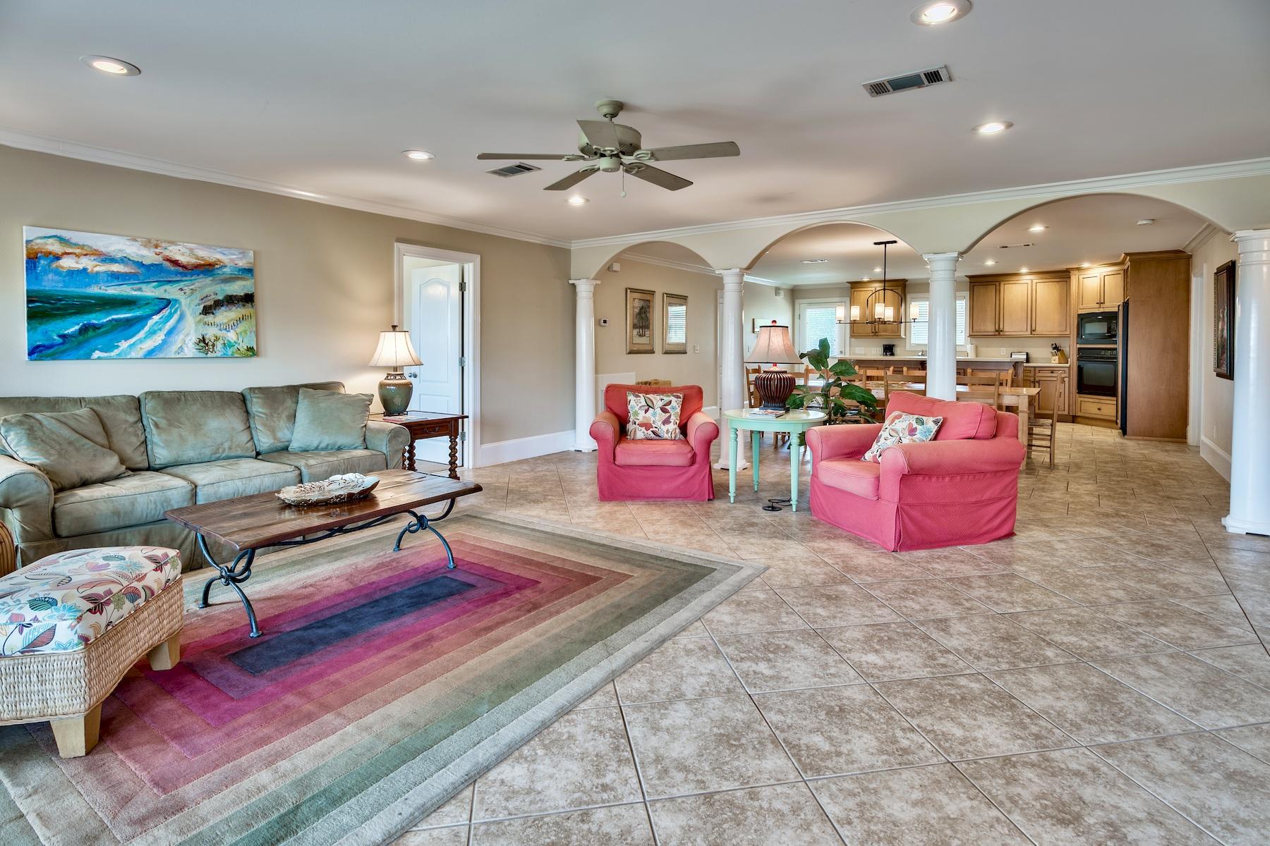 601 Blue Mountain Road Santa Rosa Beach, FL 32459 - Photo 8 of 51 a living room with furniture a rug and a chandelier