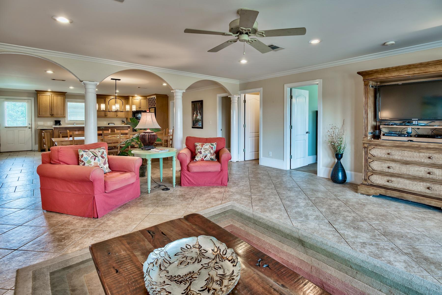 601 Blue Mountain Road Santa Rosa Beach, FL 32459 - Photo 9 of 51 a living room with furniture and a flat screen tv