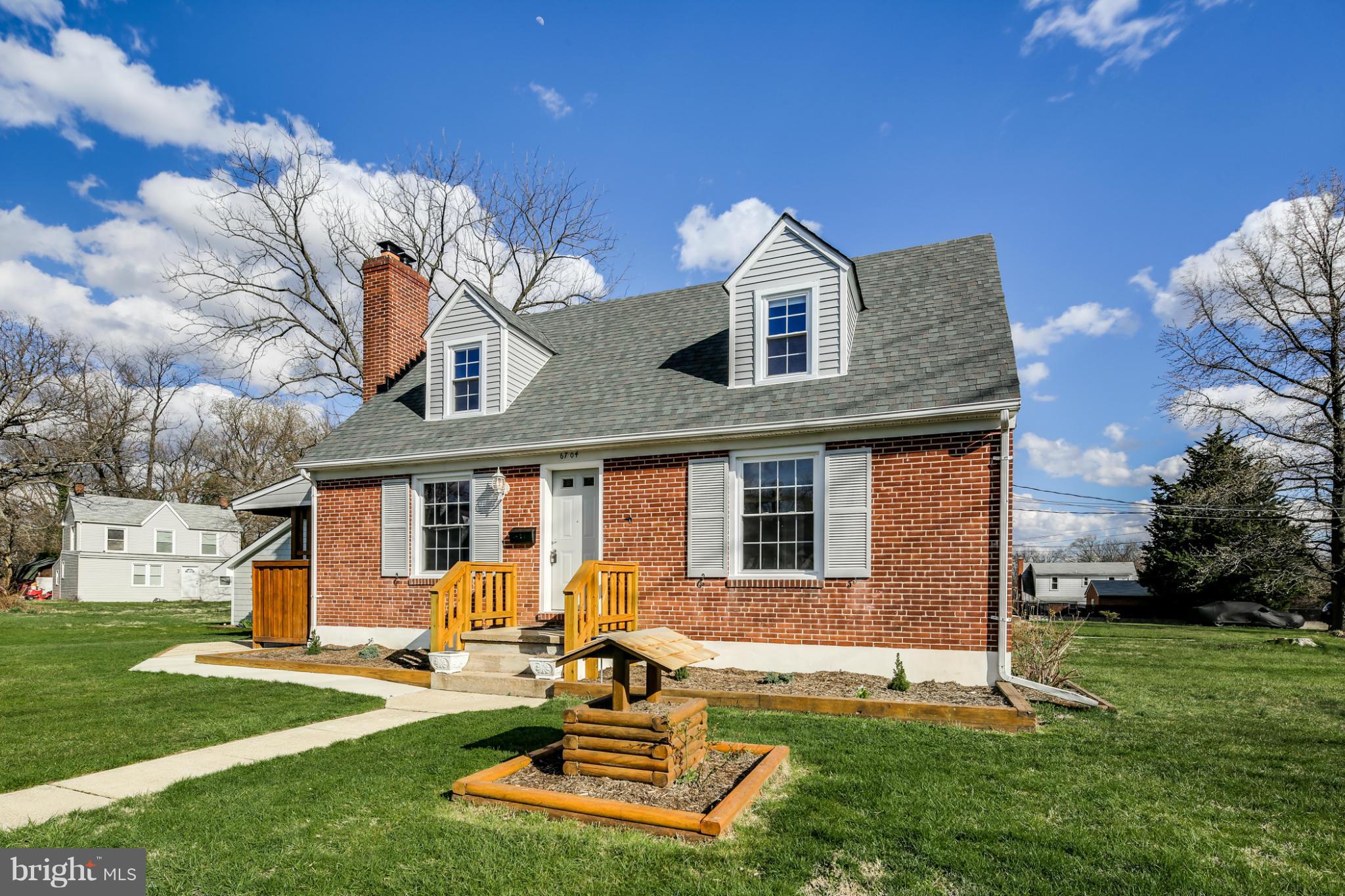 6704 Campfield Road Baltimore, MD 21207 - Photo 2 of 30 a view of a house with backyard sitting area and garden
