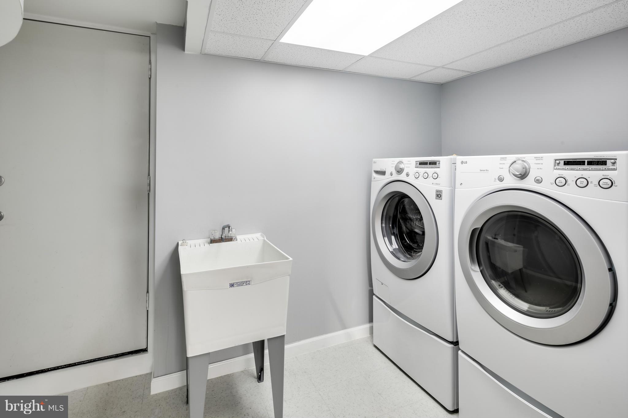 6704 Campfield Road Baltimore, MD 21207 - Photo 26 of 30 a utility room with dryer and washer