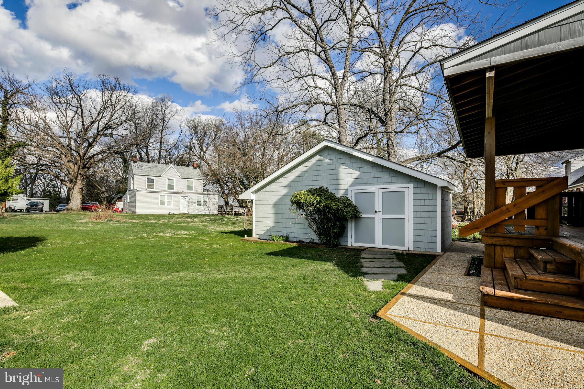 6704 Campfield Road Baltimore, MD 21207 - Photo 29 of 30 a front view of house with yard and green space
