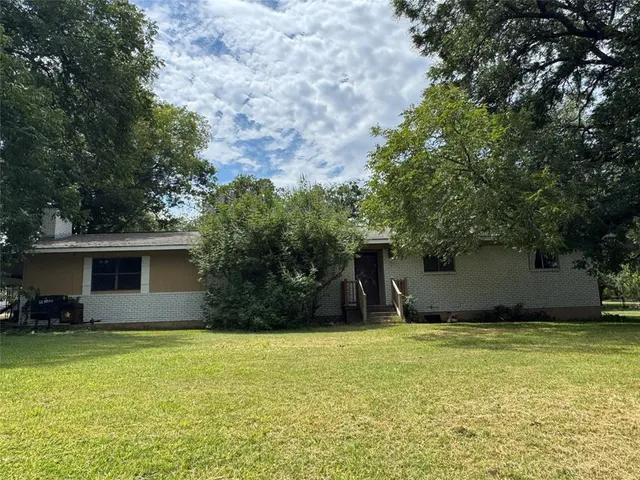 a house view with a garden space