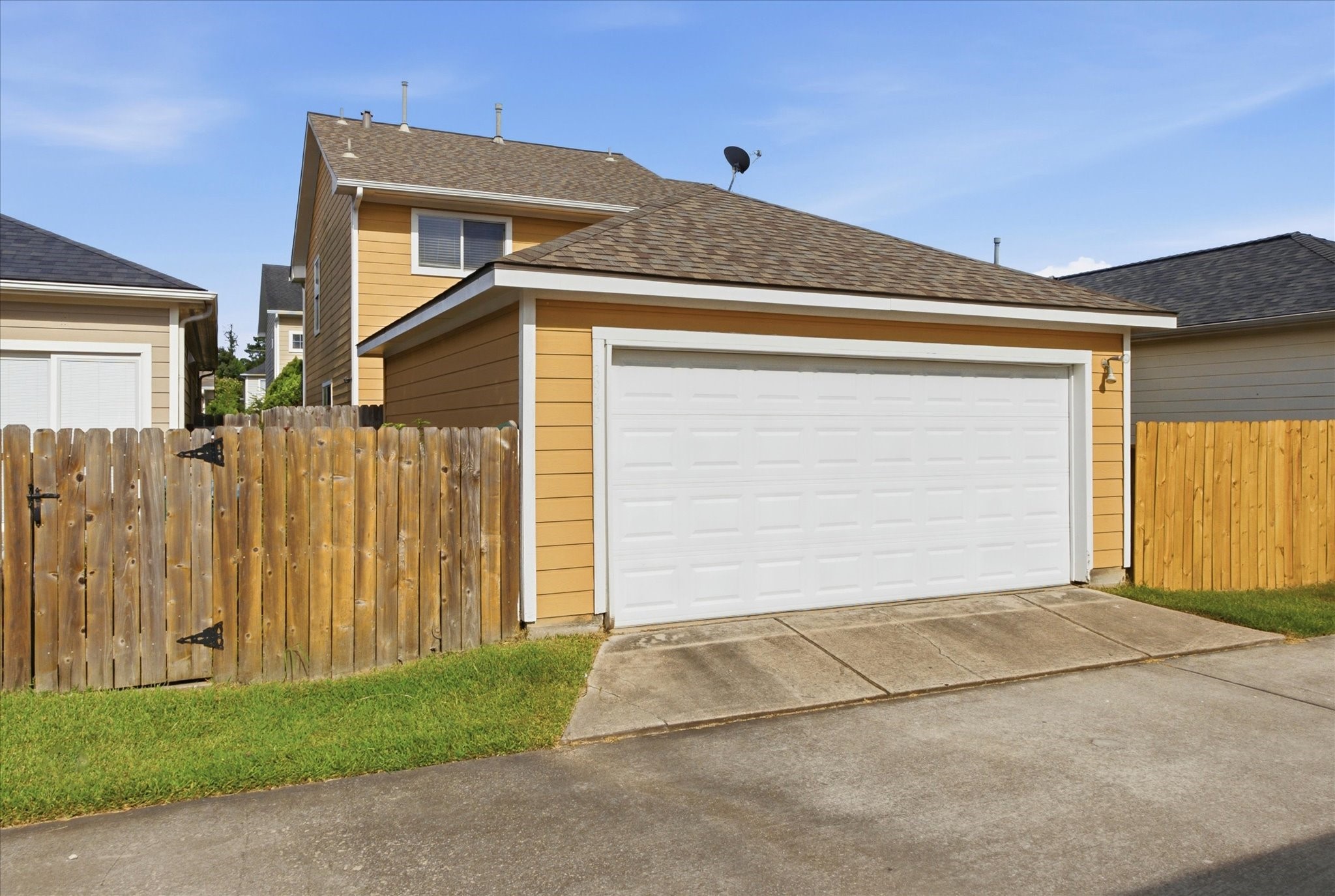 3946 Mossy Pl Lane Spring, TX 77388 - Photo 14 of 17 Alley access leads to the detached two-car garage, fully equipped with additional storage and an automatic garage door opener.