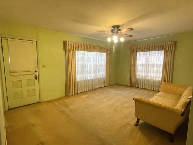 a living room with furniture and window